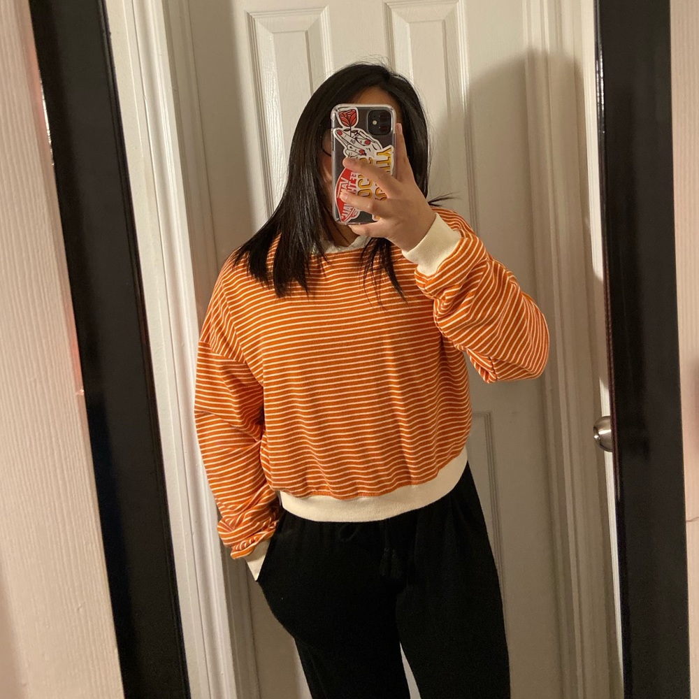 A striped peach sweater